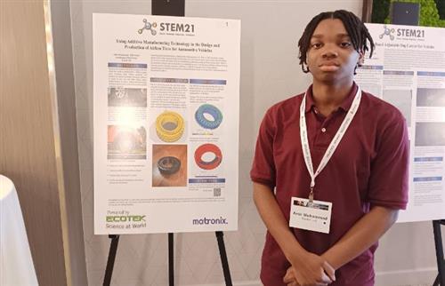 Amir M. posing with project